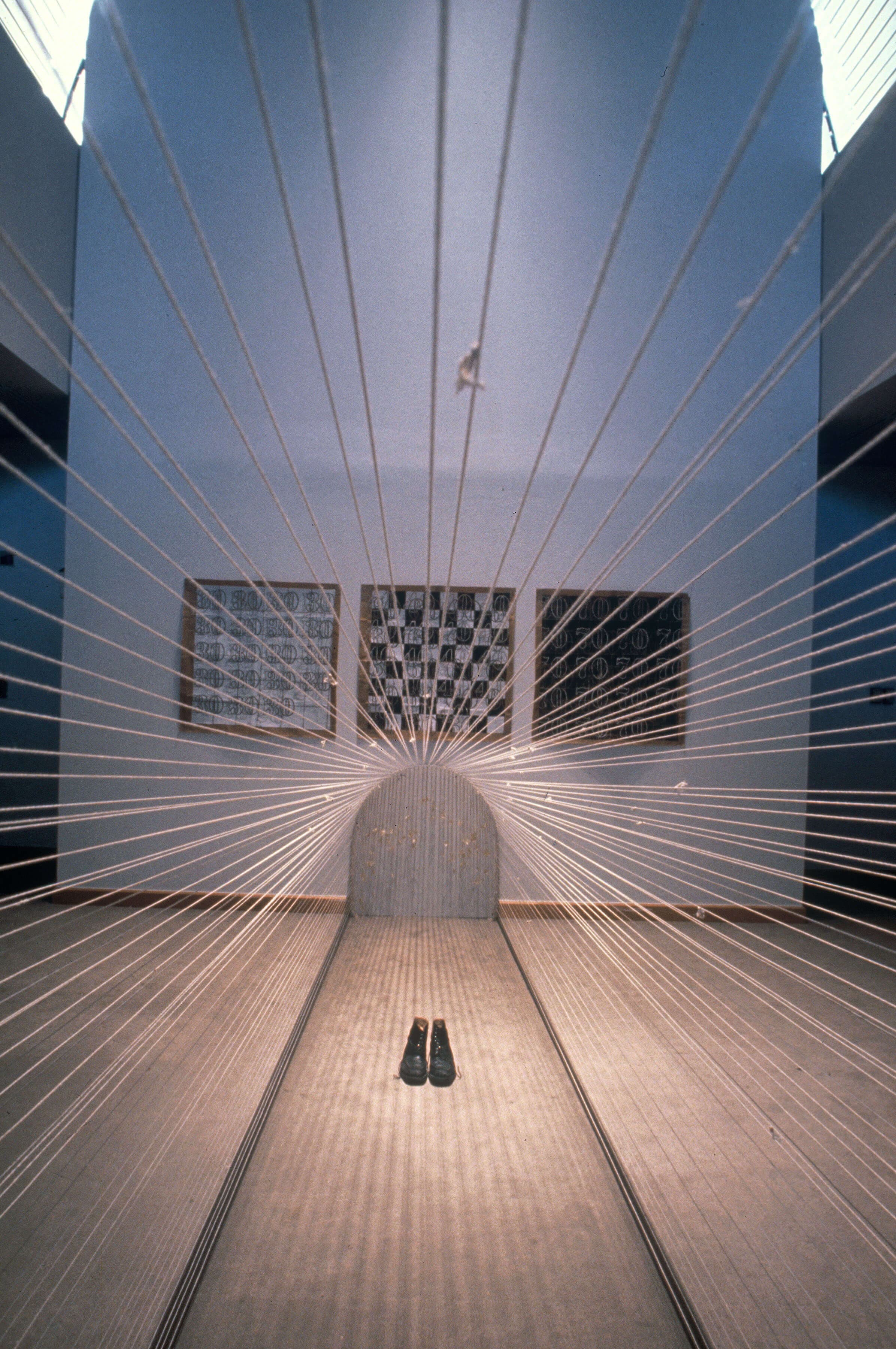 Installation, 1998, African American Museum, Dallas, TX String, paper. Boots, eye hooks, 50 x 12 x 12 feet